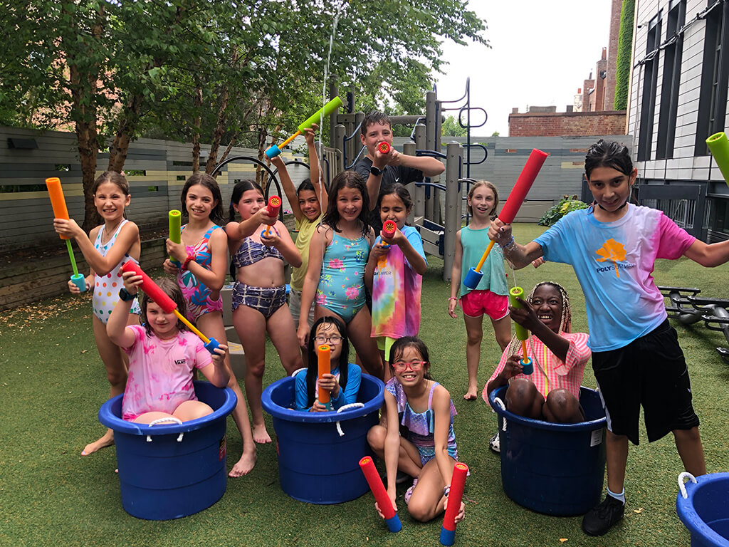 Poly summer students hanging out at a sports event