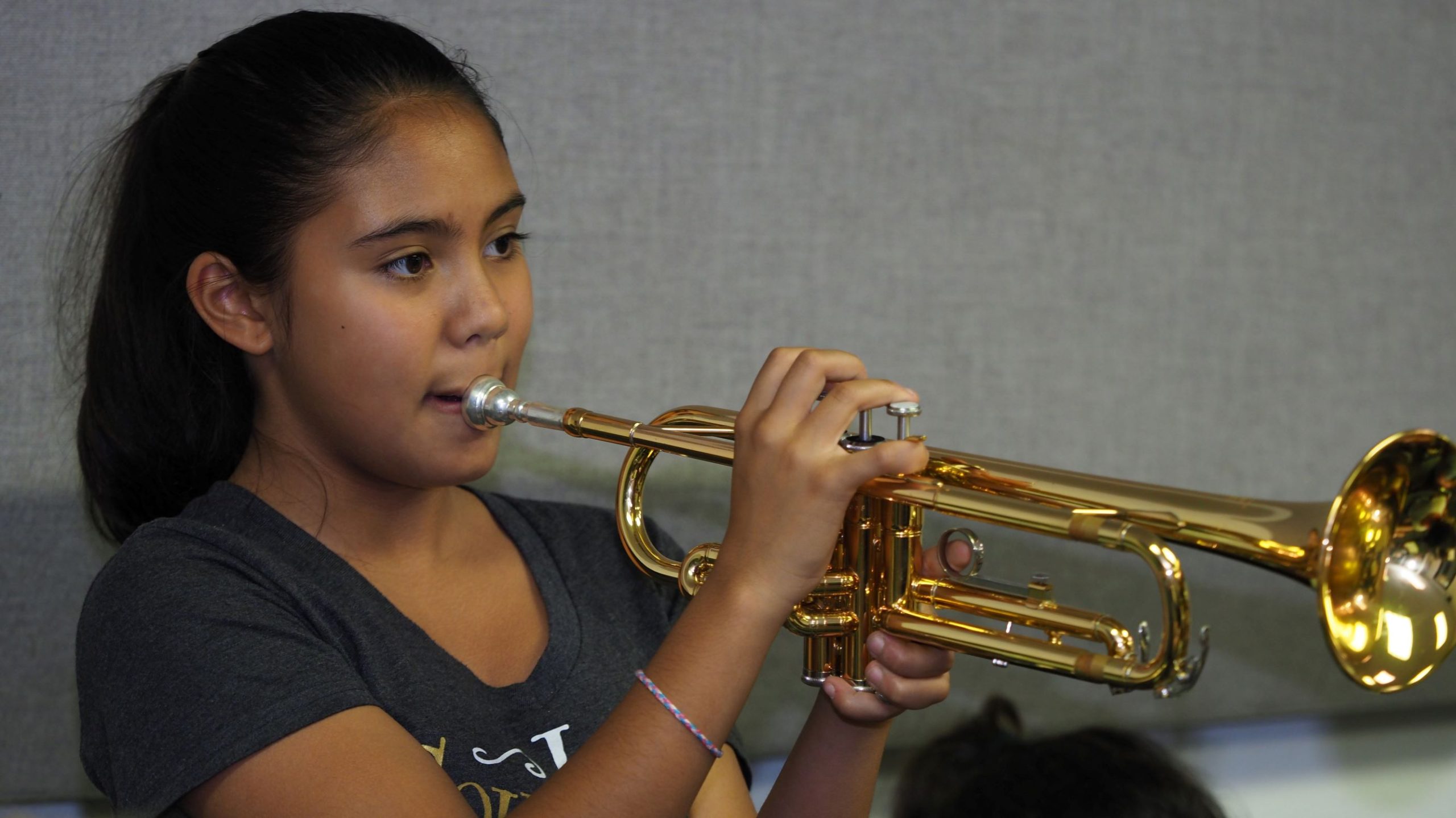 Poly summer camper playing trumpet